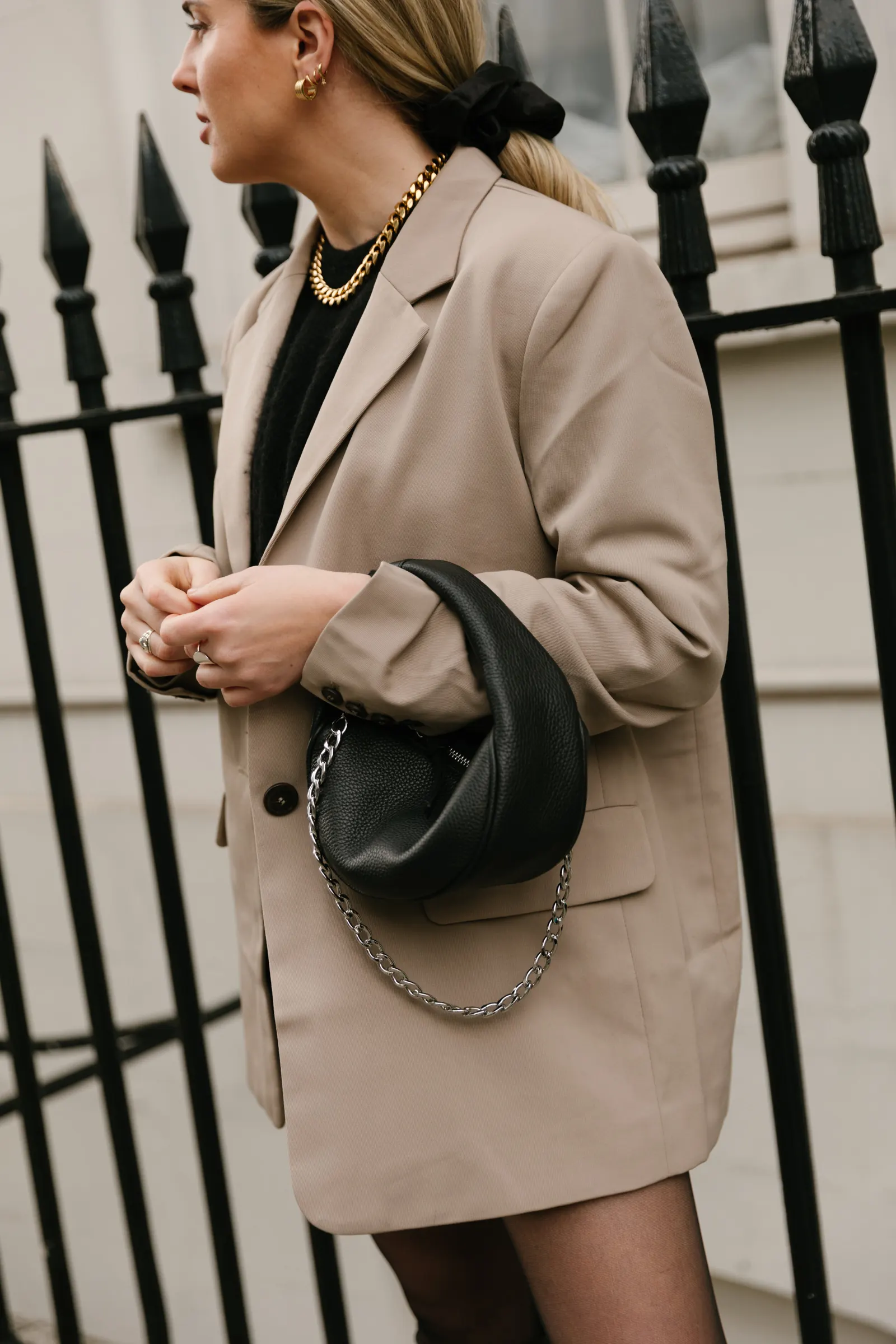 Emily in a beige blazer