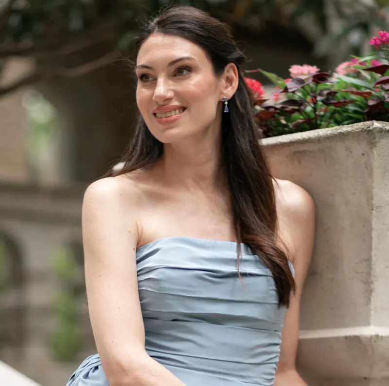 Molly, etiquette coach, in a blue strapless top