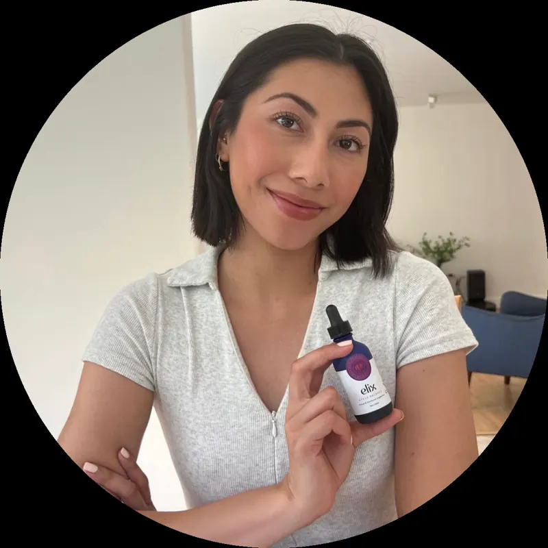 Stacey Yasis holding a serum bottle
